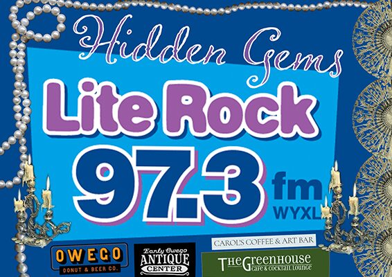 Blue radio-promotional poster with 'Hidden Gems' and 'Lite Rock 97.3 FM WYXL' text, framed by pearl borders and sponsor logos at the bottom, advertising the station's music format.