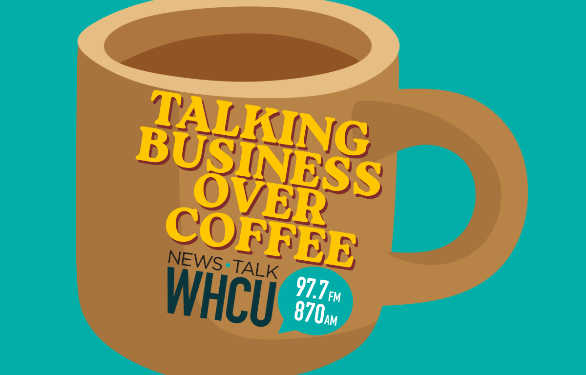 Brown coffee mug on teal background with bold yellow text 'Talking Business Over Coffee' and WHCU 97.7 FM / 870 AM badge, suggesting a talk show graphic.