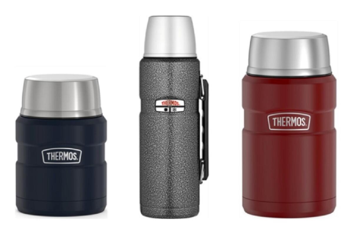 Three Thermos insulated bottles lined up: navy on the left, a gray speckled bottle with a clip in the middle, and red on the right, all with silver lids.