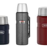 Three Thermos insulated bottles lined up: navy on the left, a gray speckled bottle with a clip in the middle, and red on the right, all with silver lids.