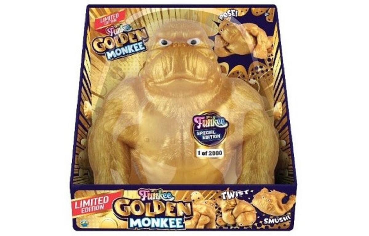 Limited edition golden monkey plush toy in its colorful packaging (1 of 2000) with 'Golden Monkee' branding on the front badge and boxes.