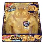 Limited edition golden monkey plush toy in its colorful packaging (1 of 2000) with 'Golden Monkee' branding on the front badge and boxes.