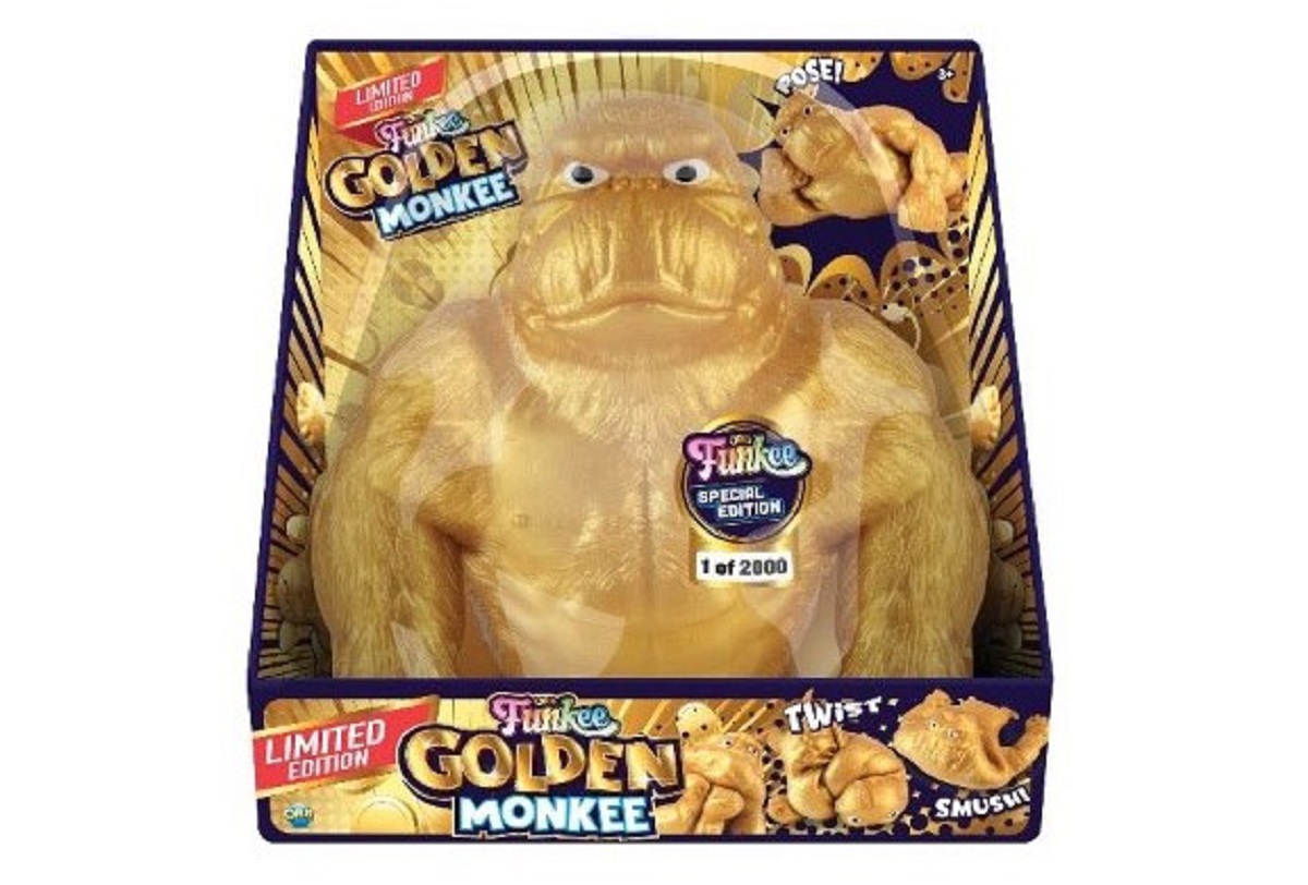 Limited edition golden monkey plush toy in its colorful packaging (1 of 2000) with 'Golden Monkee' branding on the front badge and boxes.