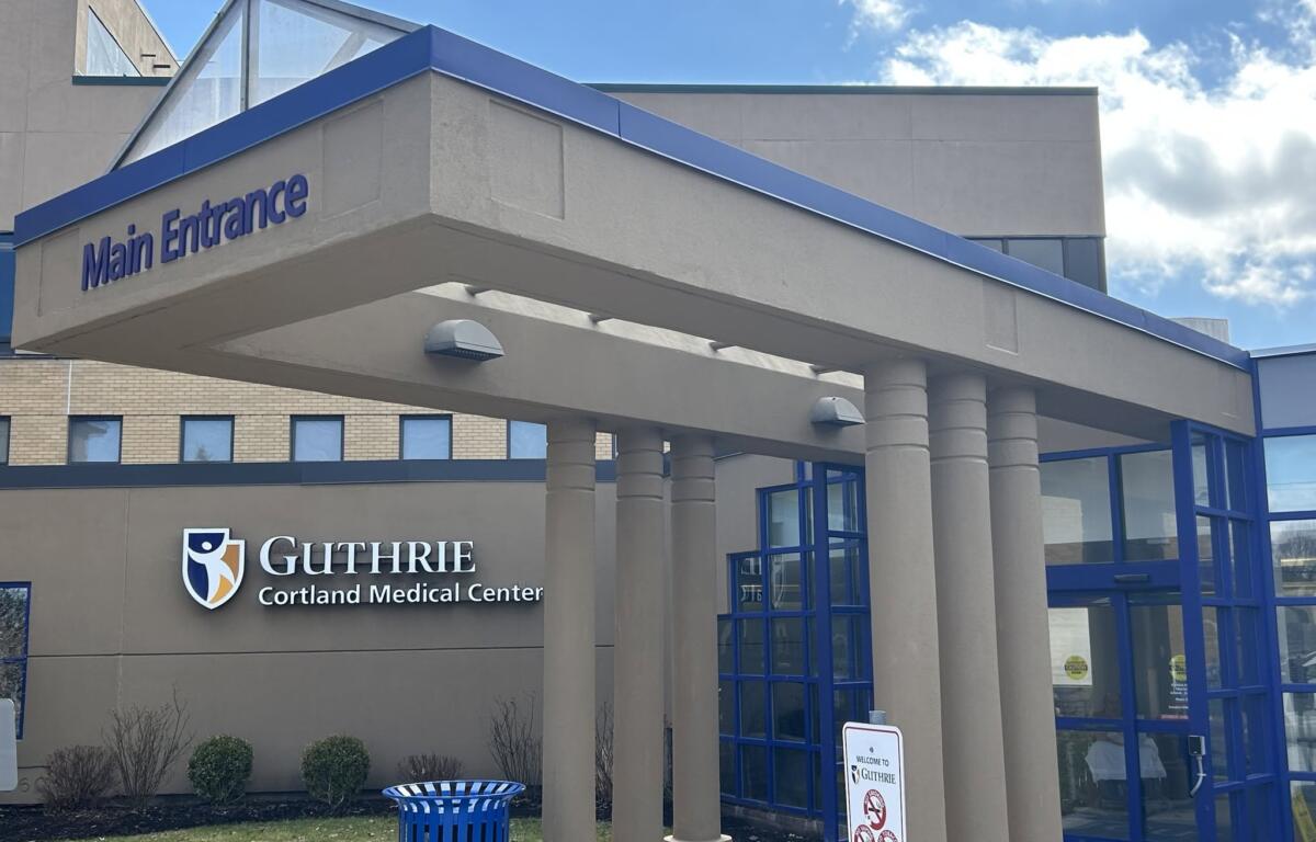 Main Entrance of Guthrie Cortland Medical Center with blue trim and glass doors.