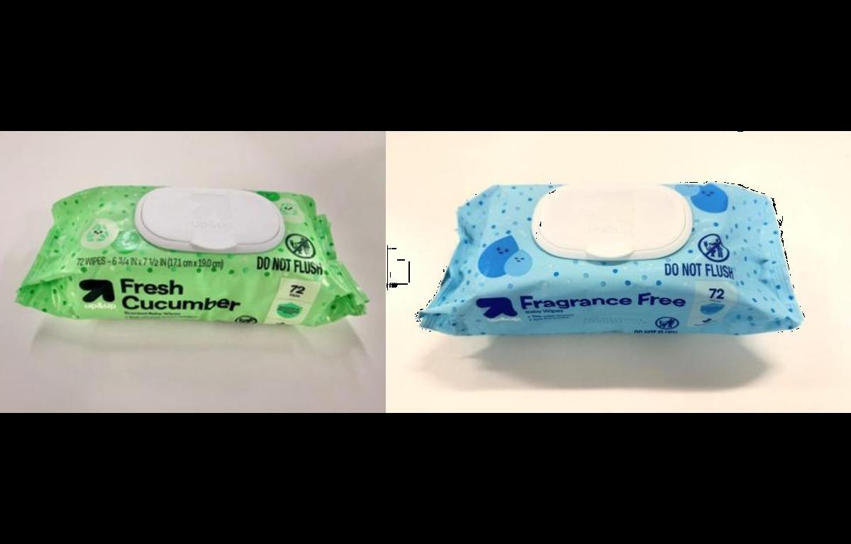 Two wet wipe packs side by side: green cucumber-scented on the left and blue fragrance-free on the right.