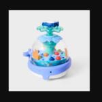 Colorful children's water play fountain with a blue base, clear dome, and multicolored balls inside.